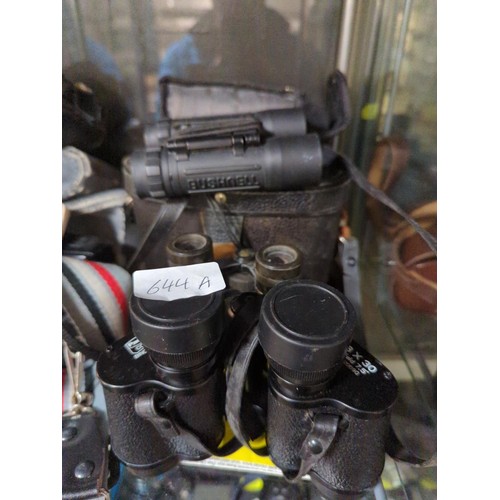 644A - Three pair of binoculars, Paragon 8 x 30, Bushnell 10 x 25 and older style with Paris stamp. Cases f... 