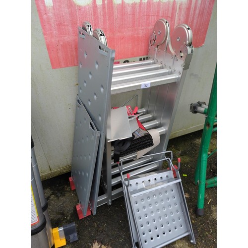 92 - Aluminium 3 way ladder & platform, includes rubber levelling pads. Appears unused.