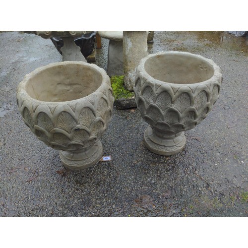 104 - A pair of concrete Pineapple Urns - a deep pineapple pattern planter on circular base. H49cm D36cm