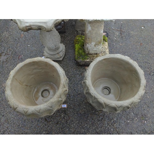 104 - A pair of concrete Pineapple Urns - a deep pineapple pattern planter on circular base. H49cm D36cm