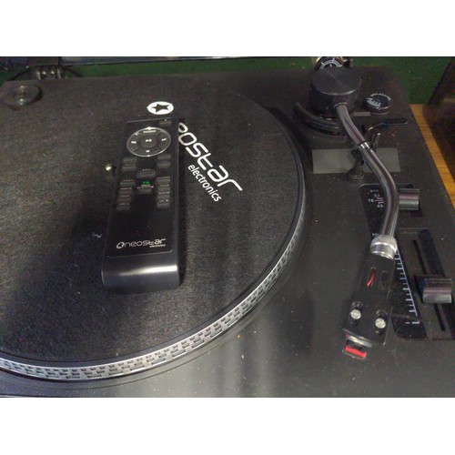 276 - Neistar electronic turntable, radio, cassette, and CD player with glass lid and tone arm in place.&n... 