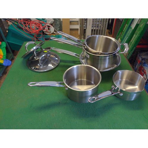 303 - Set of four graduated Prestige stainless steel cooking pans with saucepan