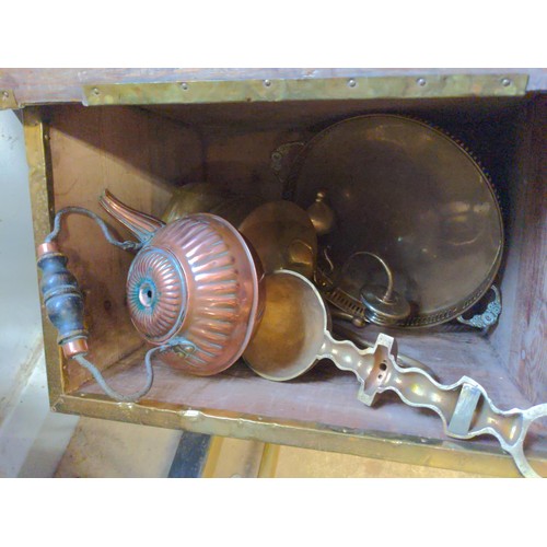 334 - Brass coal box containing brass fire companion sets, a copper kettle and other brass items