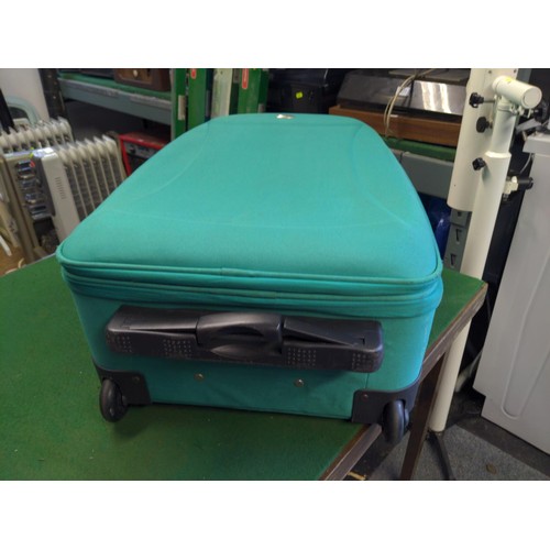 369 - Green travel case on wheels. 