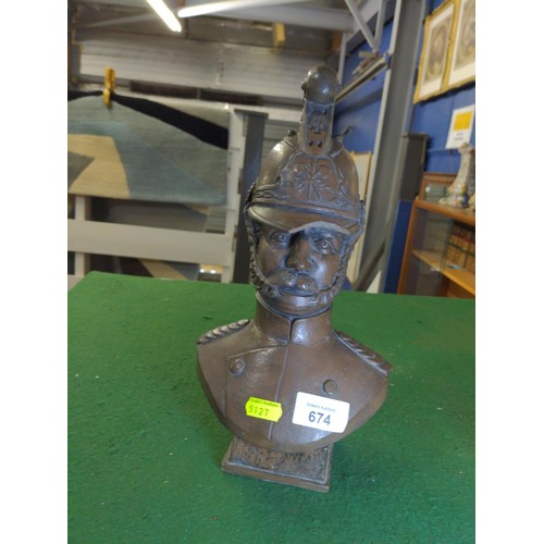 674 - Resin bust of a fireman signed Patricke ht 30cms,some damage to helmet