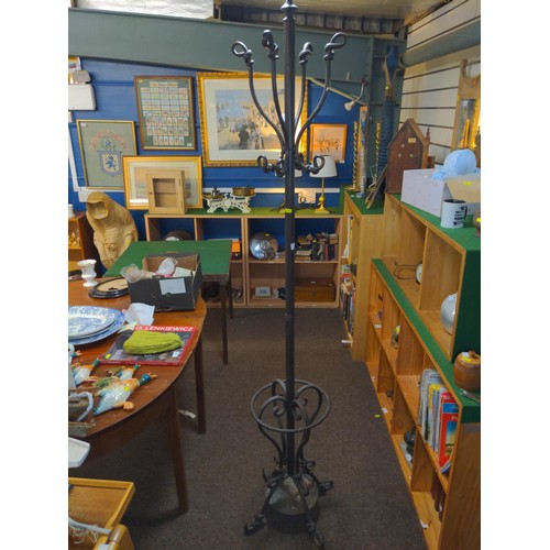 682 - Ornate metal coat stand with umbrella / stick stand base.Ht 190 cms