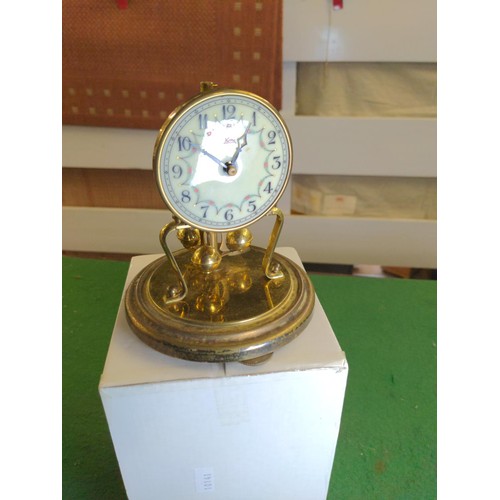 696 - Small glass domed brass clock, full ht 16cms