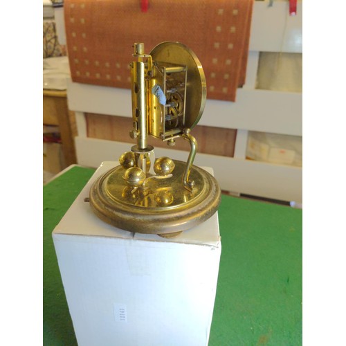 696 - Small glass domed brass clock, full ht 16cms