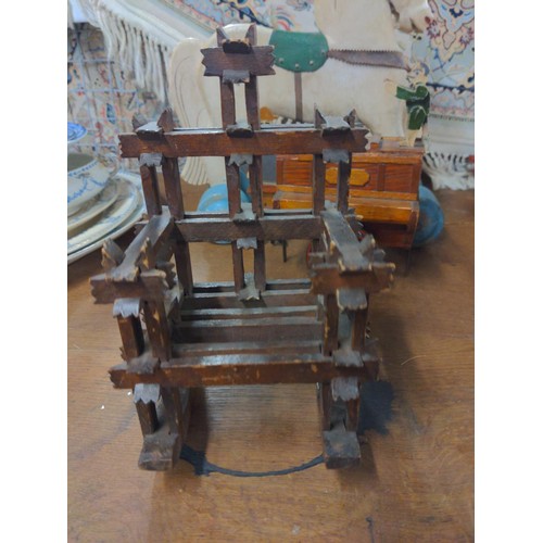 730 - Two novelty wooden money boxes, tramp art rocking chair & wheeled wooden horse