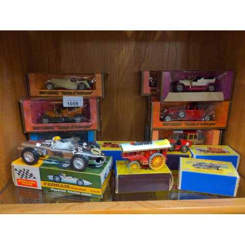 1059 - Boxed matchbox and Meisto cars over two shelfs 