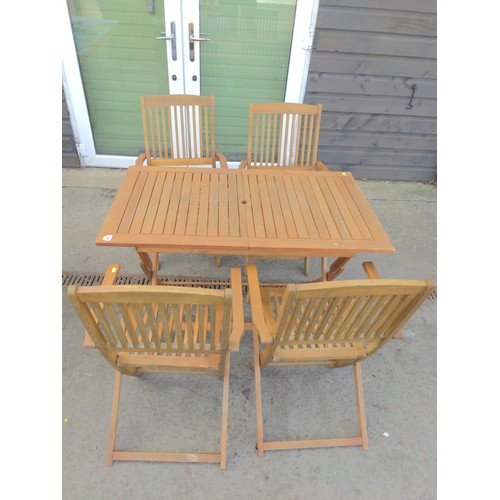 138 - Folding teak garden table with 4 folding teak chairs