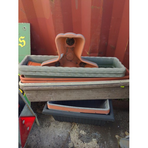 42 - Large quantity of plastic pots, planters, containers etc