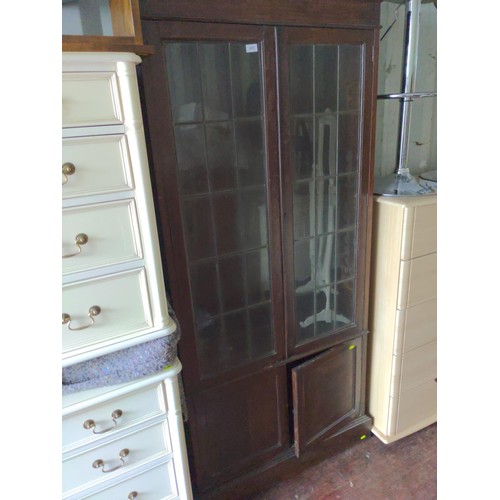 323 - Mahogany glass fronted bookcase over 2 door cupboard, fixings present but no shelvesoverall ht 211 x... 