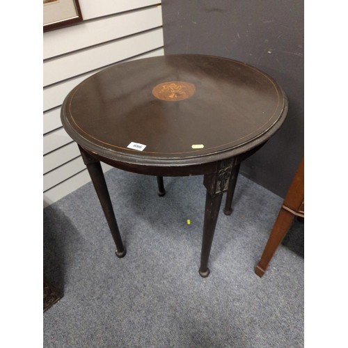 686 - Circular mahogany inlaid table. 64cm diameter.