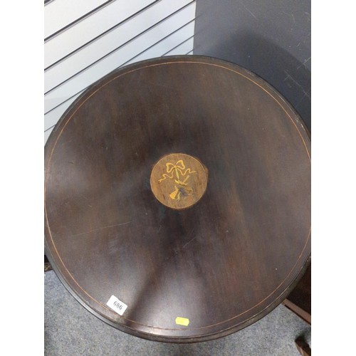 686 - Circular mahogany inlaid table. 64cm diameter.