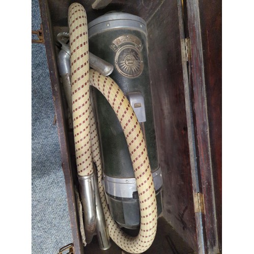 701 - Vintage Electrolux vacuum cleaner with attachments in wooden case. 