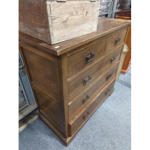 709 - 2 over 3 Art Nouveau oak chest of drawers. 107cm wide x 50cm deep x 101cm high.