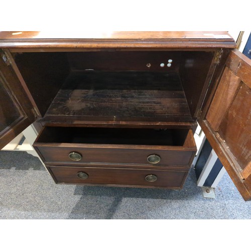 742 - Mahogany cupboard with lower drawers 66cm wide x 45cm deep x 74cm high.