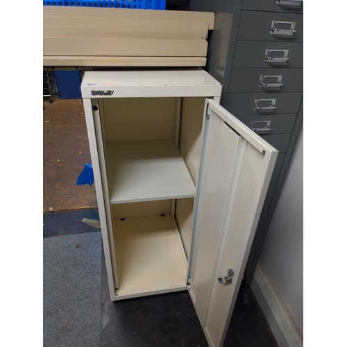 153 - Bisley metal cupboard with internal shelf and key