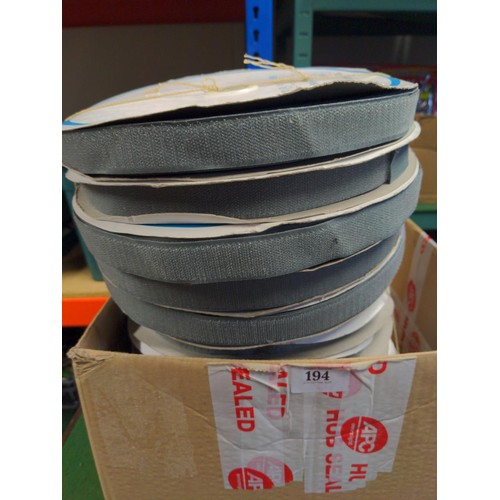 194 - Large rolls of hook/loop velcro type material. 12 rolls in total.