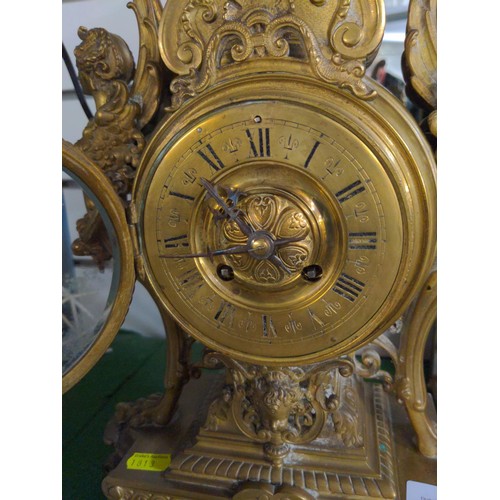 395 - French C19 gilt ornate mantle clock, with key and pendulum, height 50cm