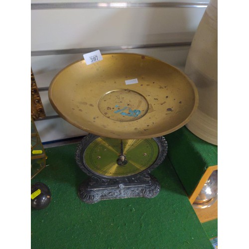 397 - Set Salter Family scales with cast iron base and brass tray and face, no weights included. H 31 cm