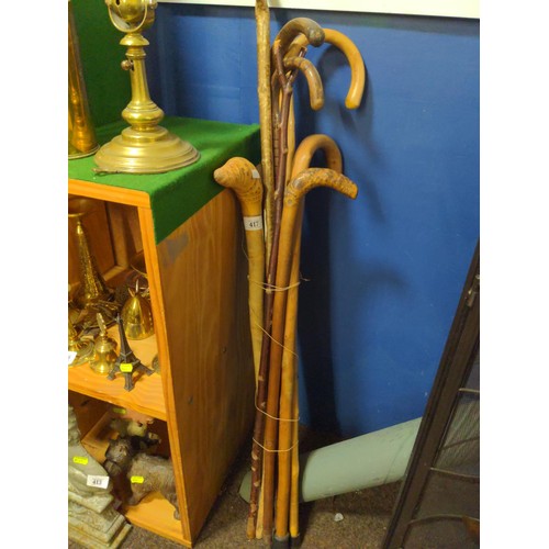 417 - Collection of 8 walking sticks of various styles.