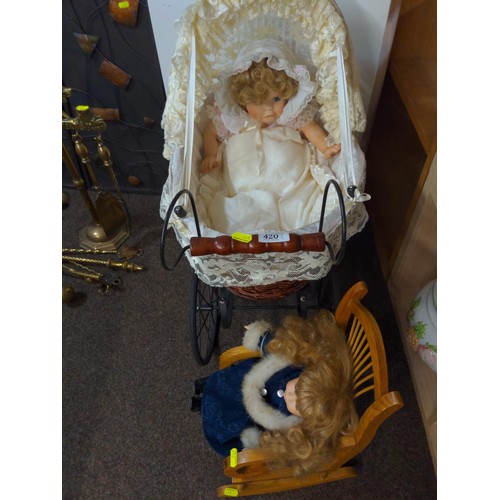 420 - Victorian style dolls pram, two period dressed dolls and a small wooden rocking chair. Pram L 60W34 ... 