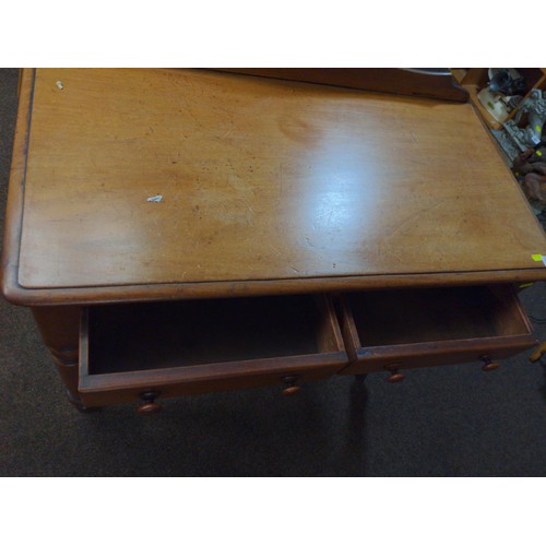 445 - Small two drawer bedroom table in mixed woods with back gallery.