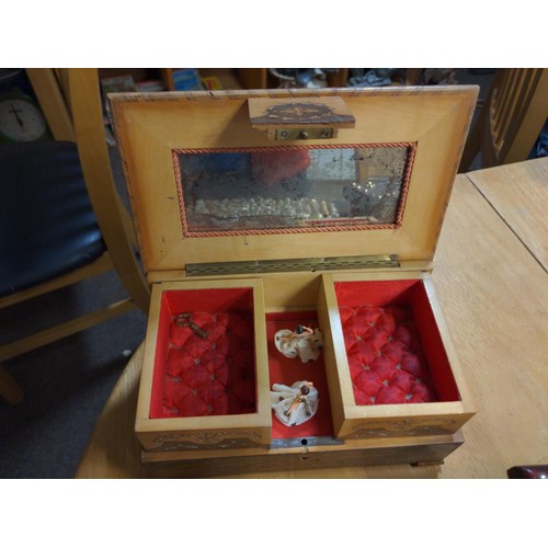 447 - Four wooden boxes one with shells on top and one is a music/jewellery box. Largest W 39cm