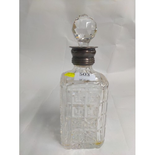 503 - Silver collared heavy cut glass decanter with stopper.