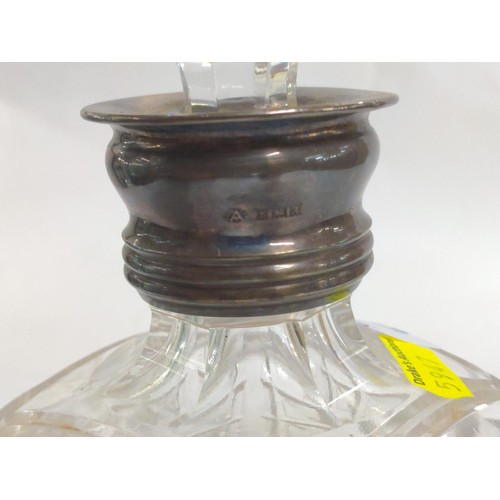 503 - Silver collared heavy cut glass decanter with stopper.