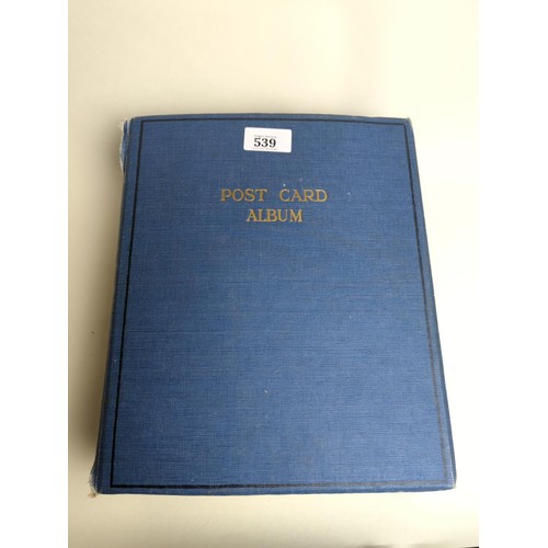 539 - Well filled album of vintage postcards