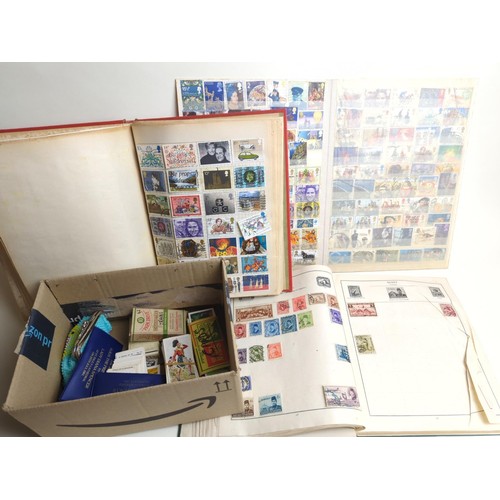 540 - Three stamp albums (not all full), tea & cigarette cards, commemorative coins and others