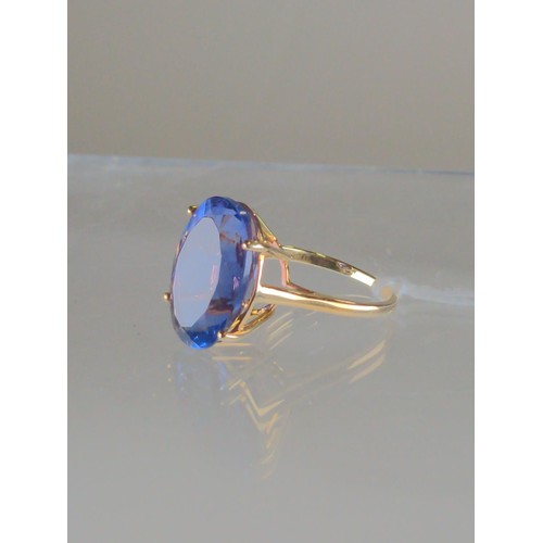 562 - 9ct gold & blue stone ring, size O, gross weight 5.18 grams