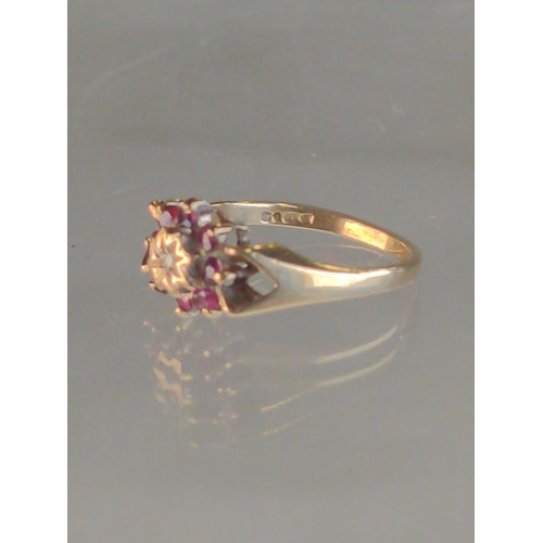 568 - 9ct gold, diamond & red stone cluster ring, size K, London hallmark, gross weight 2.2 grams