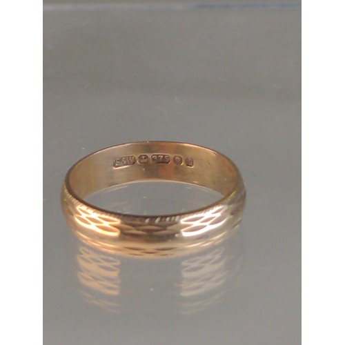 569 - 9ct gold textured band ring, size M1/2, 2.55 grams