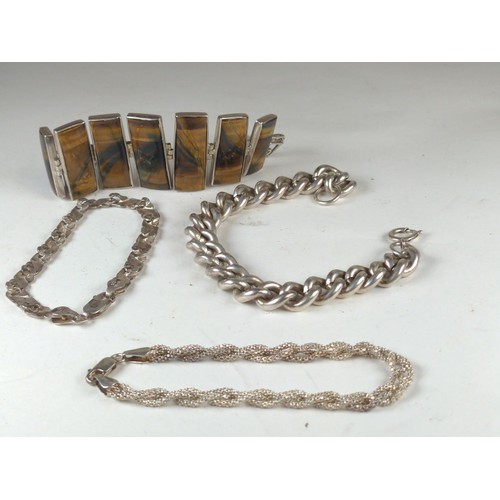 579 - Four silver bracelets, including one stone set. 67g