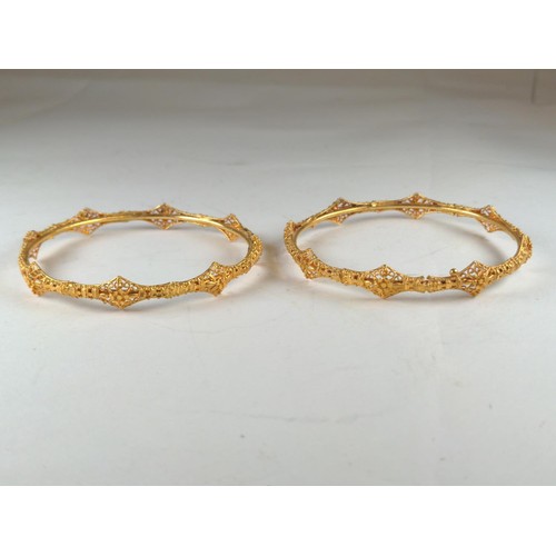 580 - Two filigree bangles