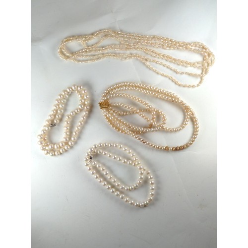 586 - Four various pearl necklaces, multi strand necklace missing third strand