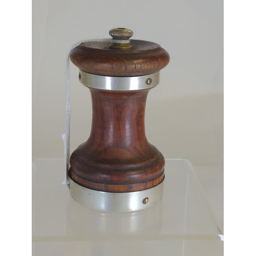 592 - Silver banded wooden pepper grinder, hallmarked John Grinsell & Sons, London 1898, height 9cm