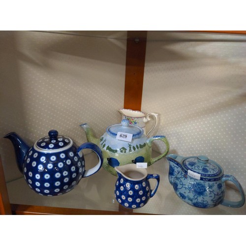 629 - Nice collection of tea pots and cream jugs in various colours and design.