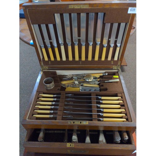 639 - Large canteen of cutlery with base drawer with large knives and forks etc. & a silver HM napkin ... 