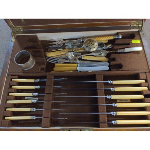 639 - Large canteen of cutlery with base drawer with large knives and forks etc. & a silver HM napkin ... 