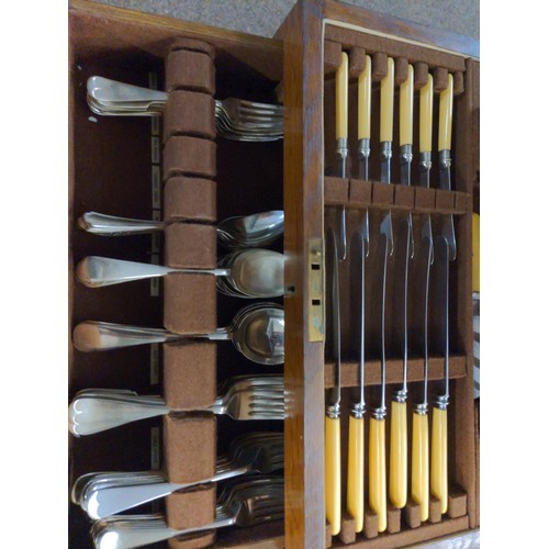 639 - Large canteen of cutlery with base drawer with large knives and forks etc. & a silver HM napkin ... 