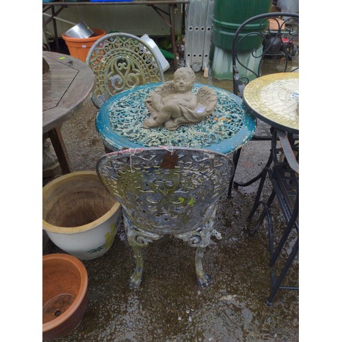 56 - Cast alloy garden table and 2 chairs, D68cm H64cm