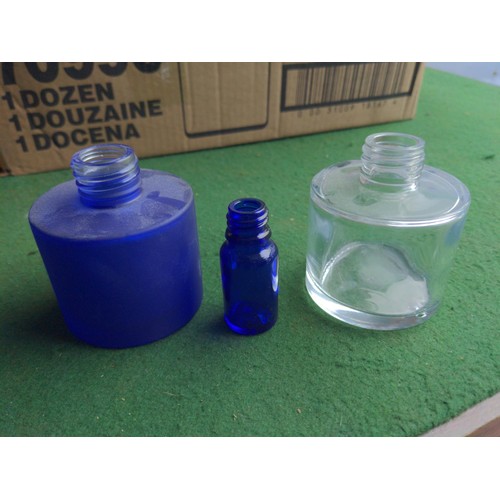 205 - 4x boxes of 100ml blue glass screw top bottles. With some variations.