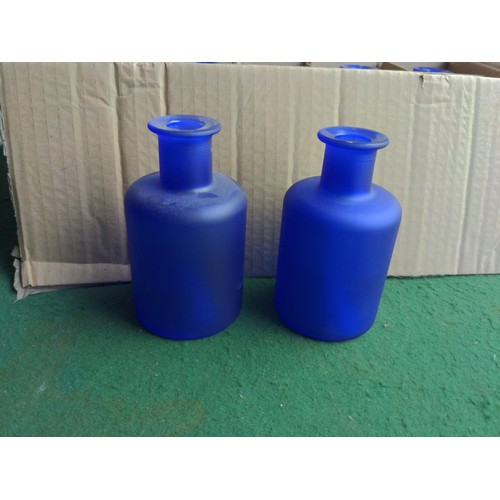 206 - 6x boxes of 200ml blue glass bottles.