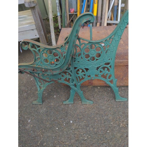 79 - Pair of green painted bench ends