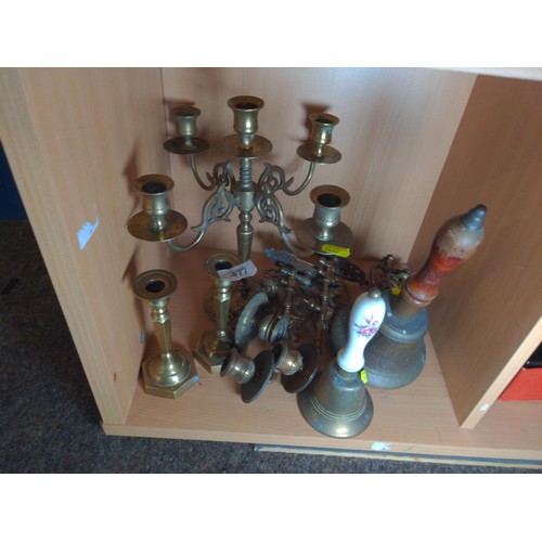 477 - Eight assorted brass candle holders in different formats and two hand bells